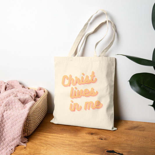 Christ Lives in Me Tote Bag, Lifestyle Natural Front